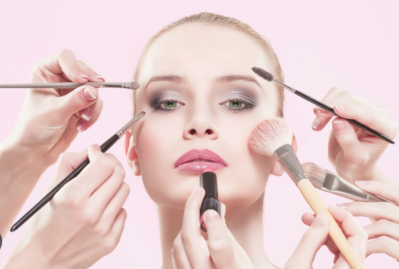 a girl with makeup brushes